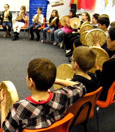 4th graders take part in drum circle with their new Native American drums.