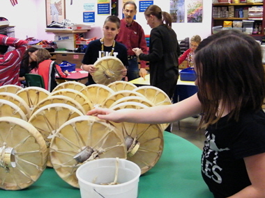 Students place finished drums together to begin drying.